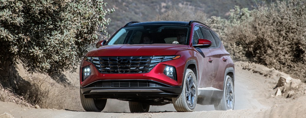 Red 2022 Hyundai Tucson in sand