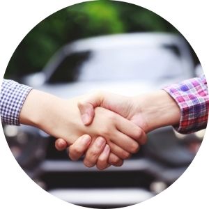 Hands Shaking in Front of a New Car