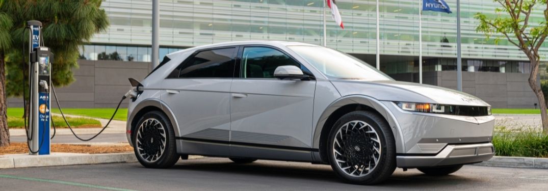 White 2022 Hyundai IONIQ 5 Charging in a Parking Lot