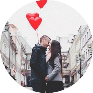 Couple with Red Heart Balloons Kissing on a Street