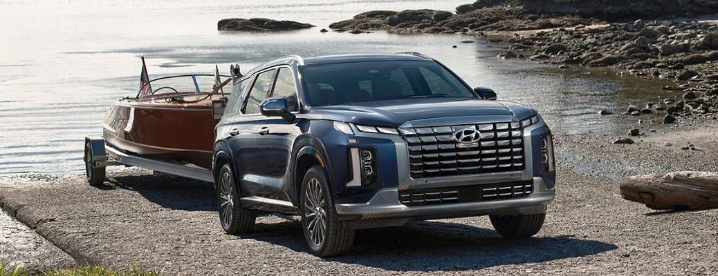 The new 2023 Hyundai Palisade pulling a boat out of the water, helping to provide a preview of the new 2023 Hyundai Palisade