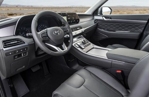 Hyundai Palisade SUV interior with driver's seat and dashboard.