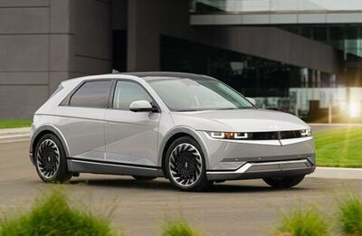 A silver Hyundai Ioniq 5 parked in a driveway.