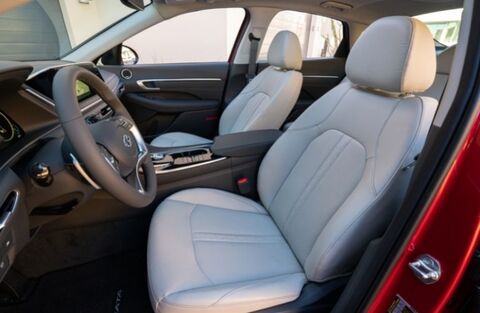 The interior of a Hyundai Sonata, showing the driver and passenger seats with comfortable-looking upholstery.