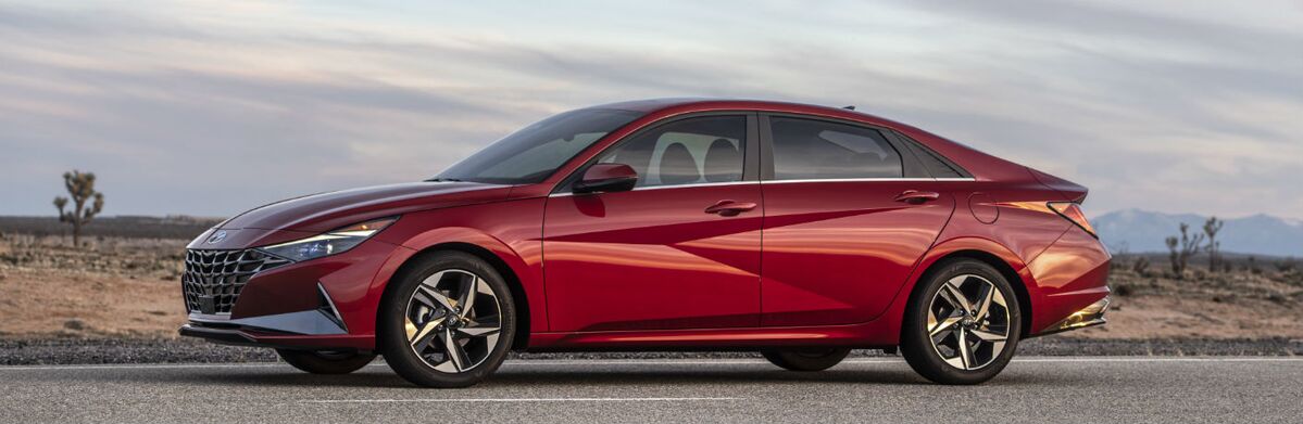Hyundai Elantra driving on a desert road.